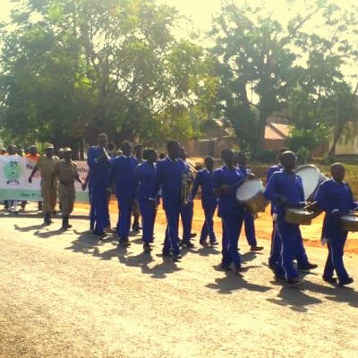 NDA staff & members of the public marching through Arua town as part of NDA@25 celebrations